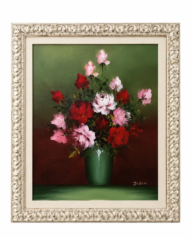 Framed floral still life with red and pink roses in a green vase